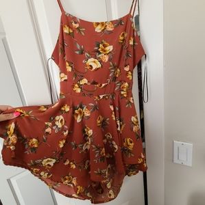 Super cute open back floral romper